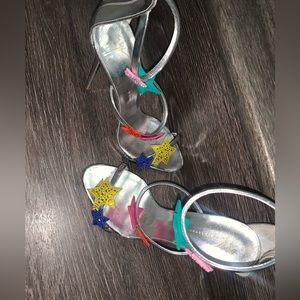 These are Giuseppe Zanotti Heels , silver size 6.5 like new .